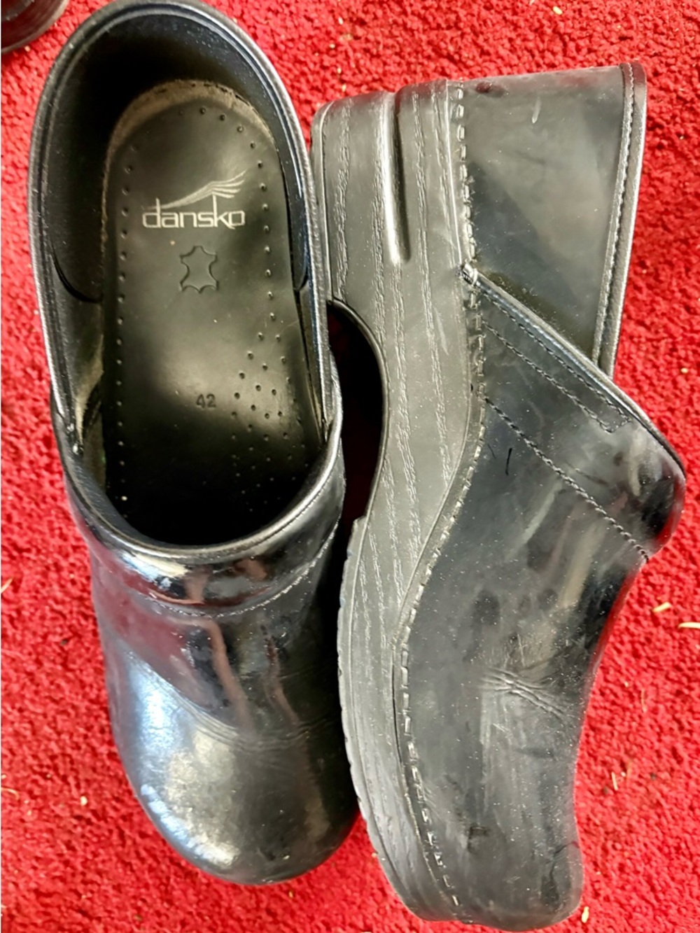 Dansko Black Patent Clogs with Slip-On Design